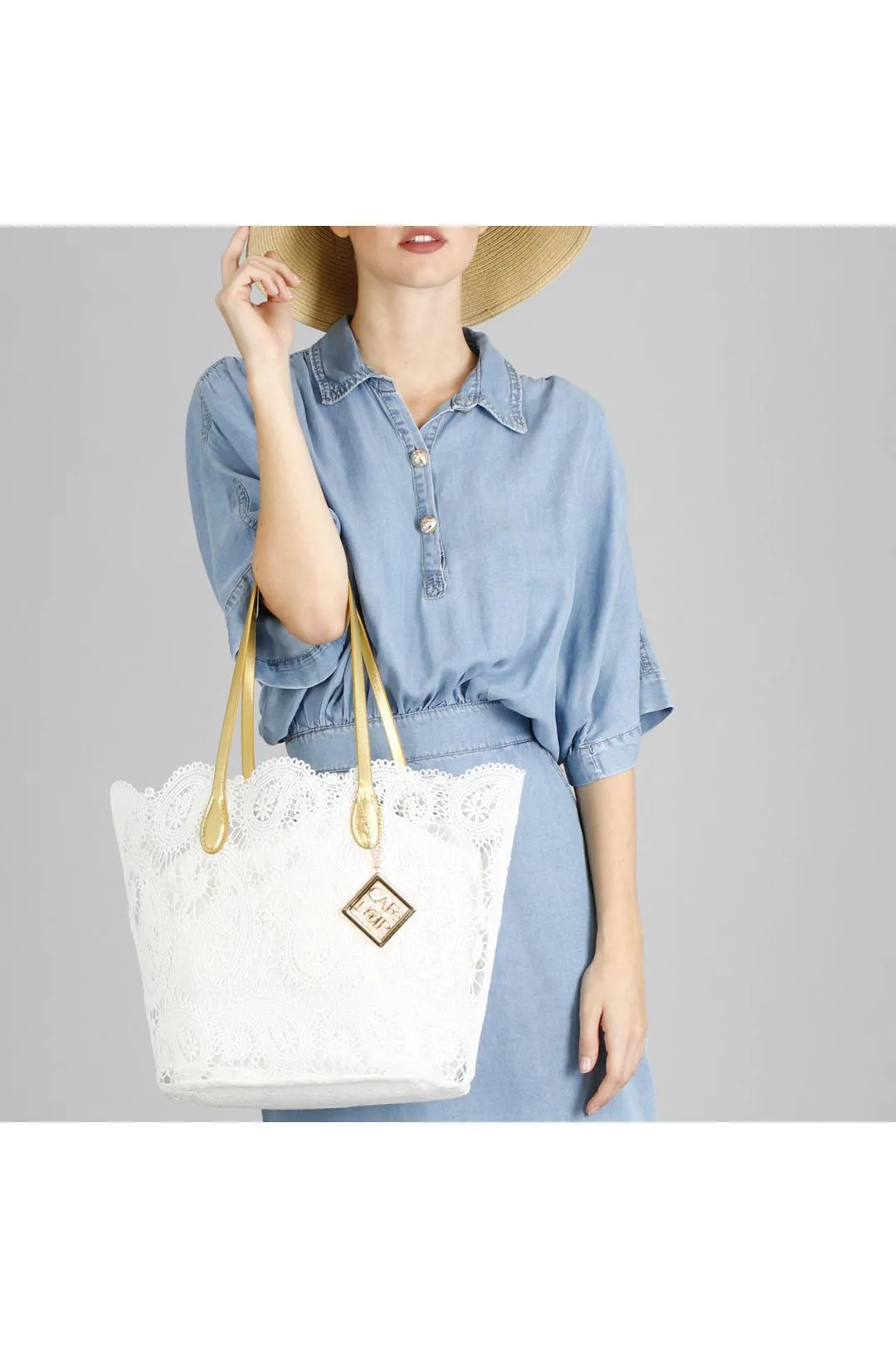shopping bag in pizzo con sacchetto interno in tono bianco
